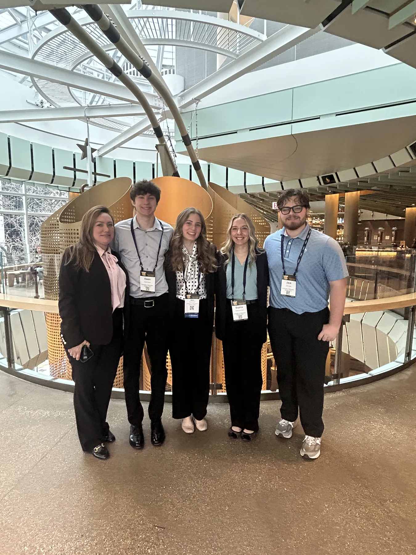 A UWSP AMA group standing together inside the Chicago conference venue.